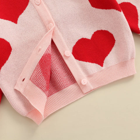 Knitted baby sweater with heart