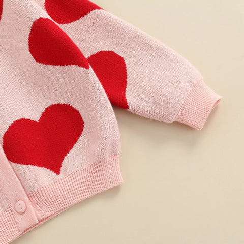 Knitted baby sweater with heart